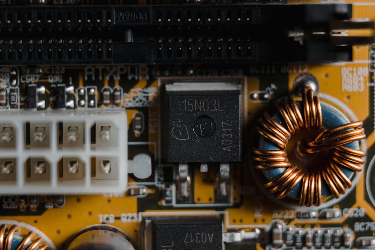 Detailed close-up of electronic components on a circuit board, showcasing intricate engineering.